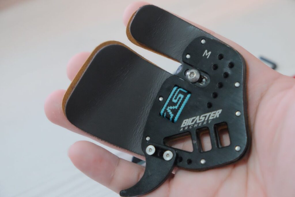 Bicaster ASA finger tab on hand
