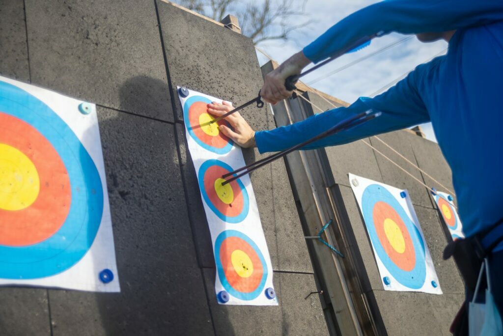 Pulling arrow from the target